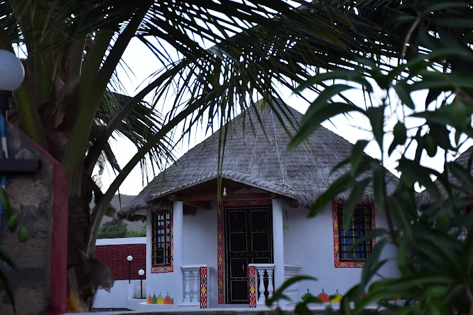 Thatched-roof cottage at Panchani Farm Villa and Resort, Kutch